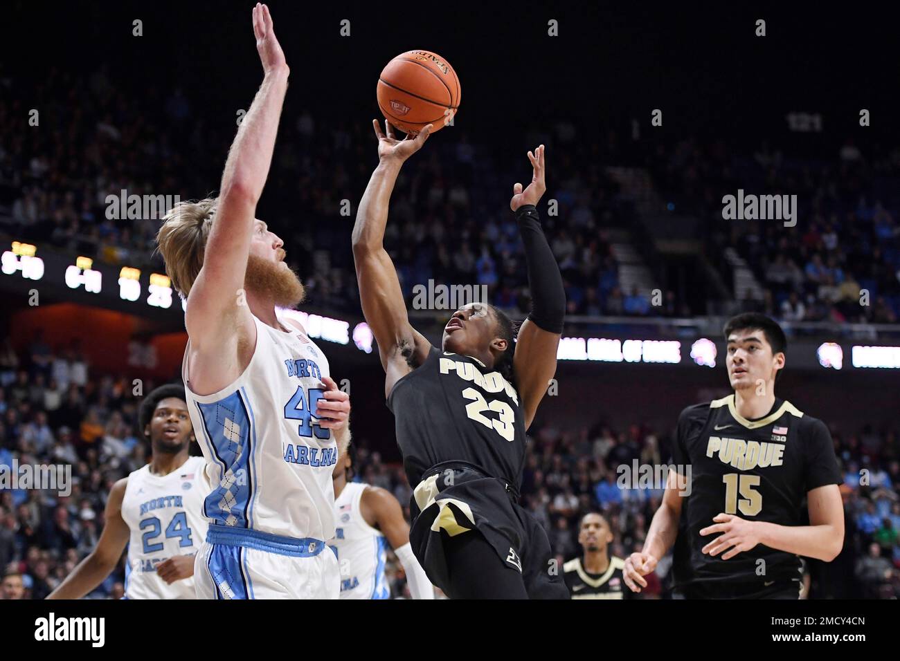 Purdue's Jaden Ivey (23) shoots over North Carolina's Brady Manek (45
