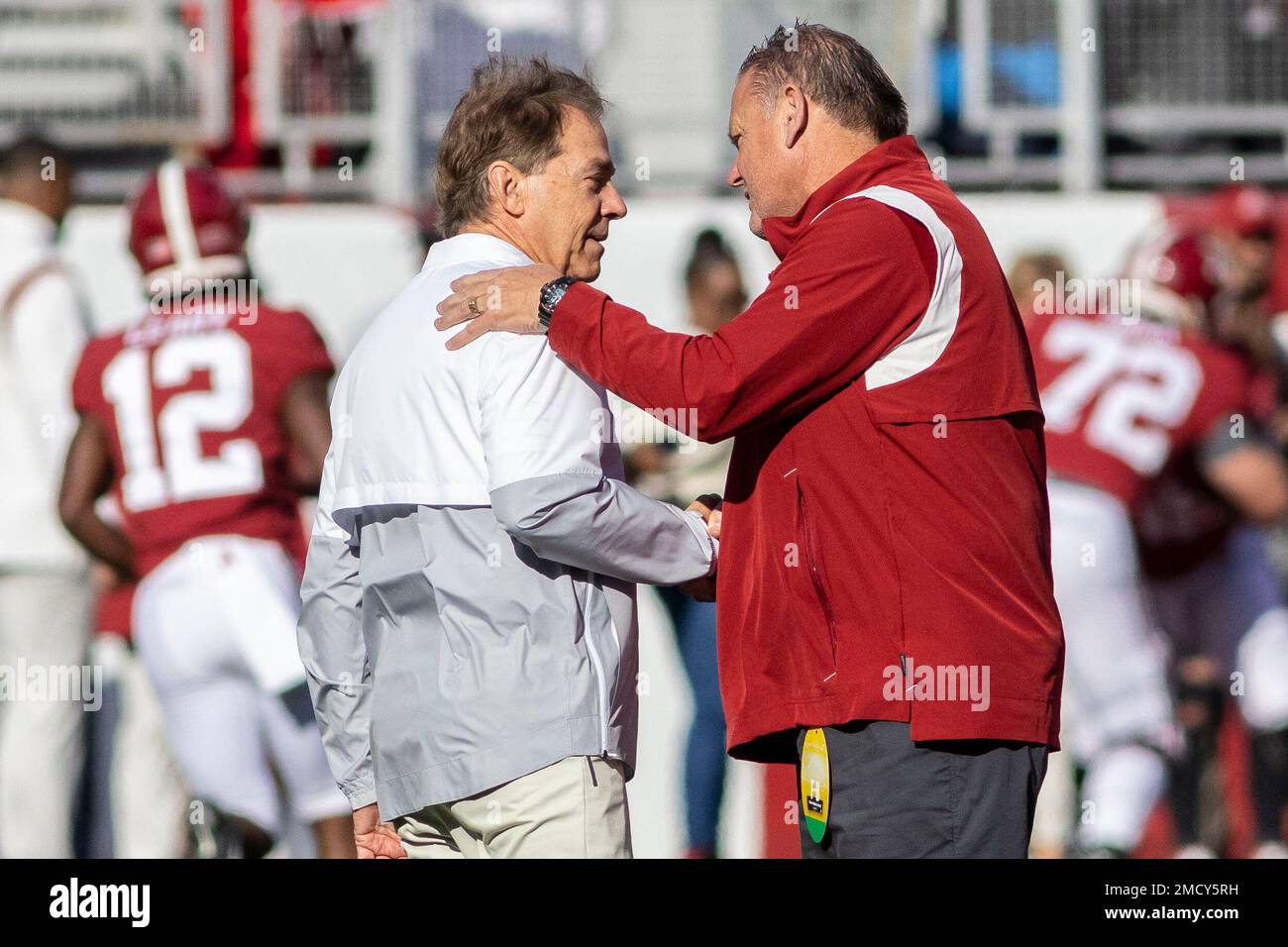 Alabama head coach Nick Saban, left, greets Arkansas head coach Sam