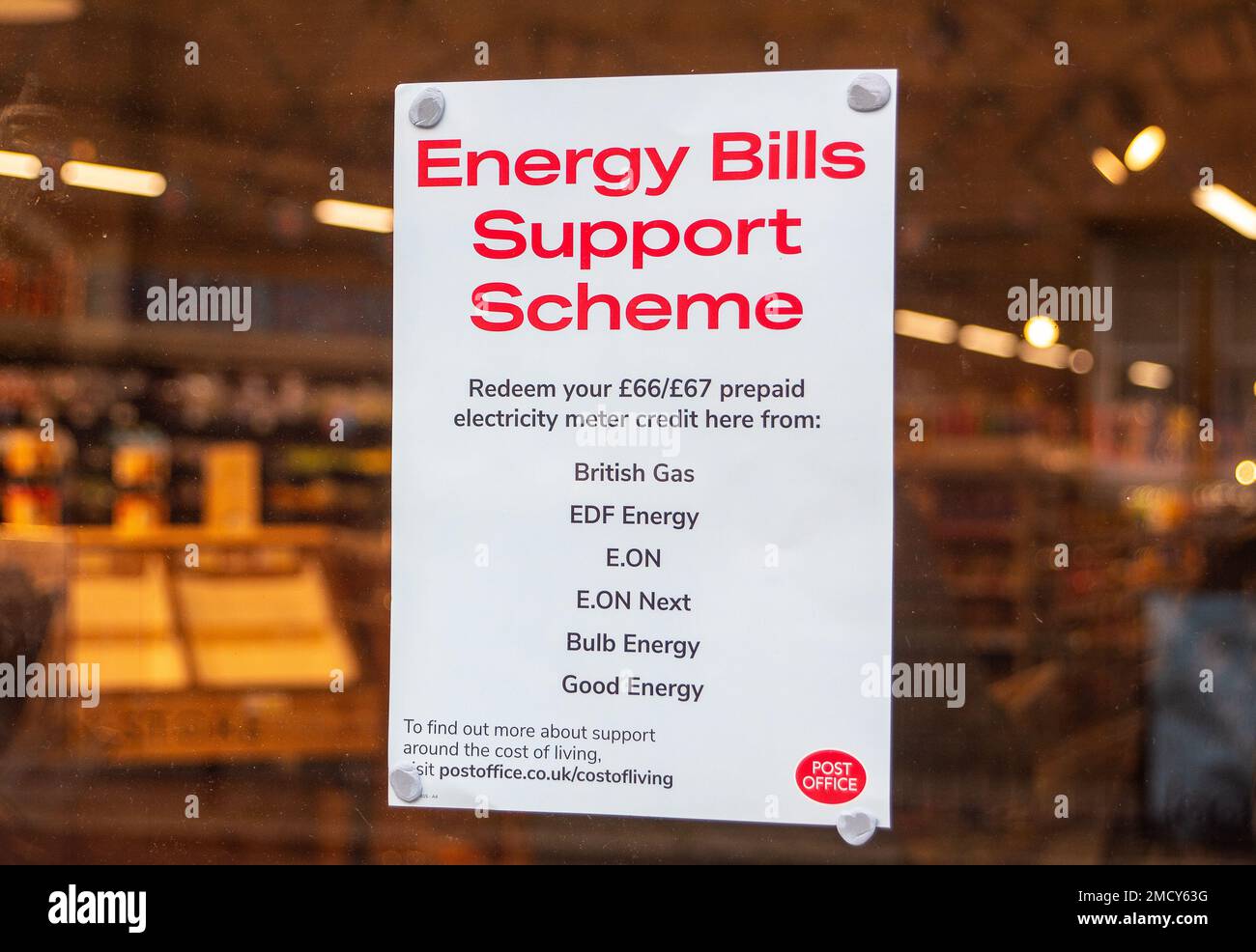 Eton, Windsor, Berkshire, UK. 22nd January, 2023. An Energy Bills Support Scheme notice in the window of a post office in Eton High Street telling pre payment customers that they can redeem their credit at the post office. Many householders are still struggling to keep their homes warm despite the help from Government as utility costs are so high this winter. Credit: Maureen McLean/Alamy Live News Stock Photo