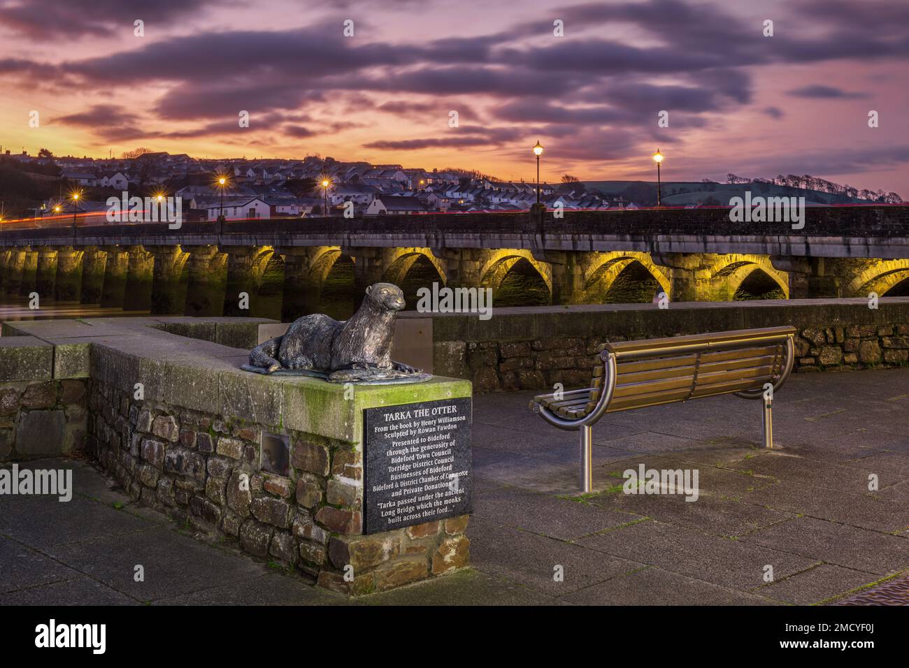 The 'Tarka the Otter' sculpture by Rowan Fawdon, beside Bideford Long Bridge, just before sunrise on a crisp January morning. In the story by Henry Wi Stock Photo
