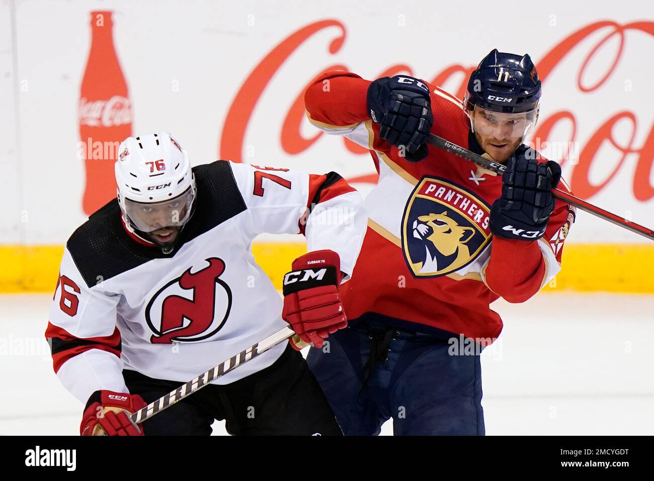 New Jersey Devils defenseman P.K. Subban (76) and Florida Panthers left  wing Jonathan Huberdeau (11) battle for the puck during the third period of  an NHL hockey game, Thursday, Nov. 18, 2021,