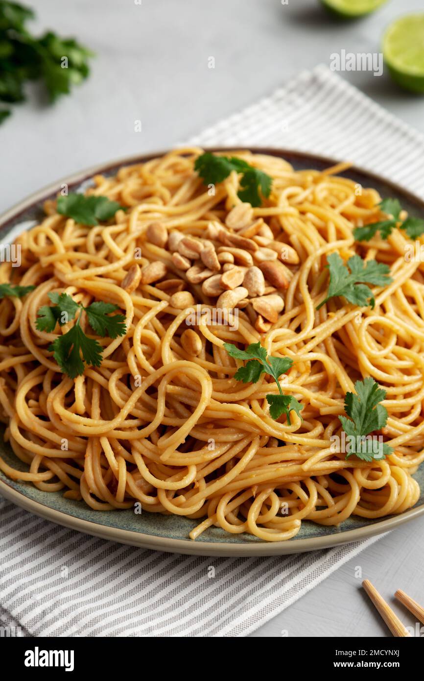 Homemade Asian Peanut Sauce Noodles on a Plate, side view Stock Photo