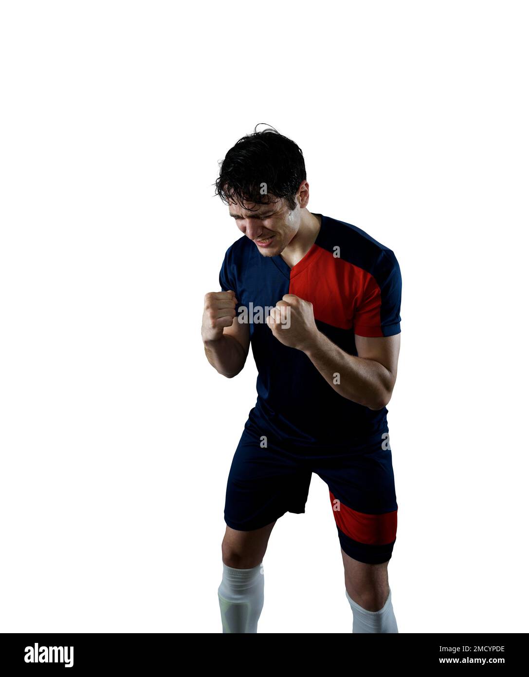 Football scene with a striker soccer player who exults Stock Photo - Alamy