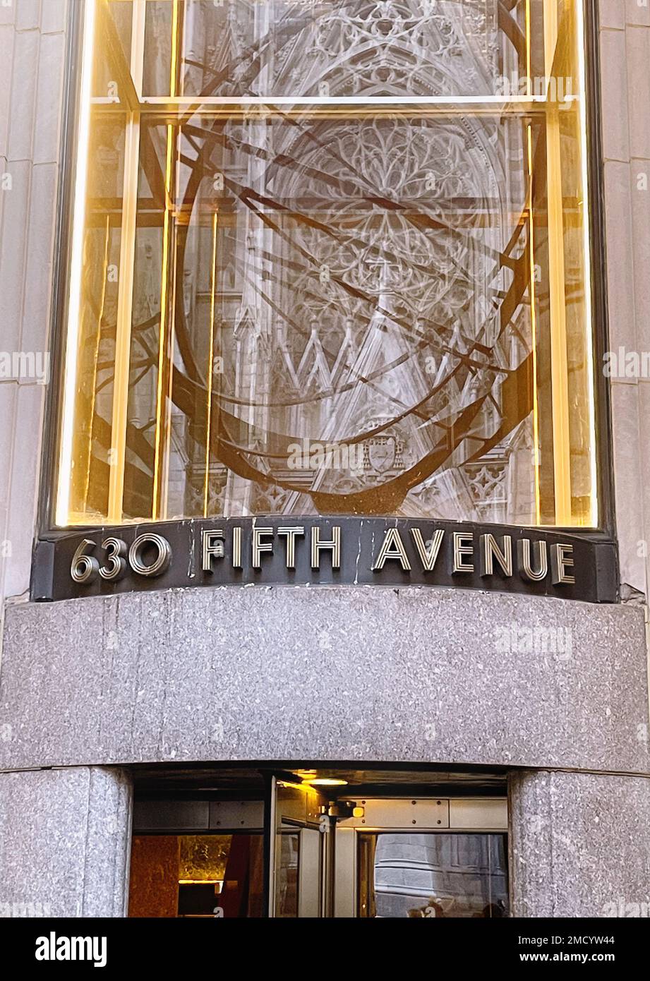 Atlas Holding the Heavens (celestial vault) Statue (armillary sphere) in Rockefeller Center and Reflected in the Window of 630 Fifth Avenue, NYC, USA Stock Photo