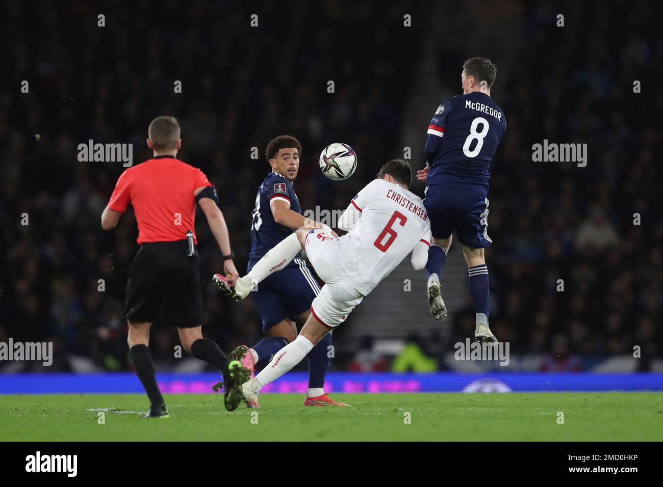 Denmark's Andreas Christensen, second right, fights for the ball with