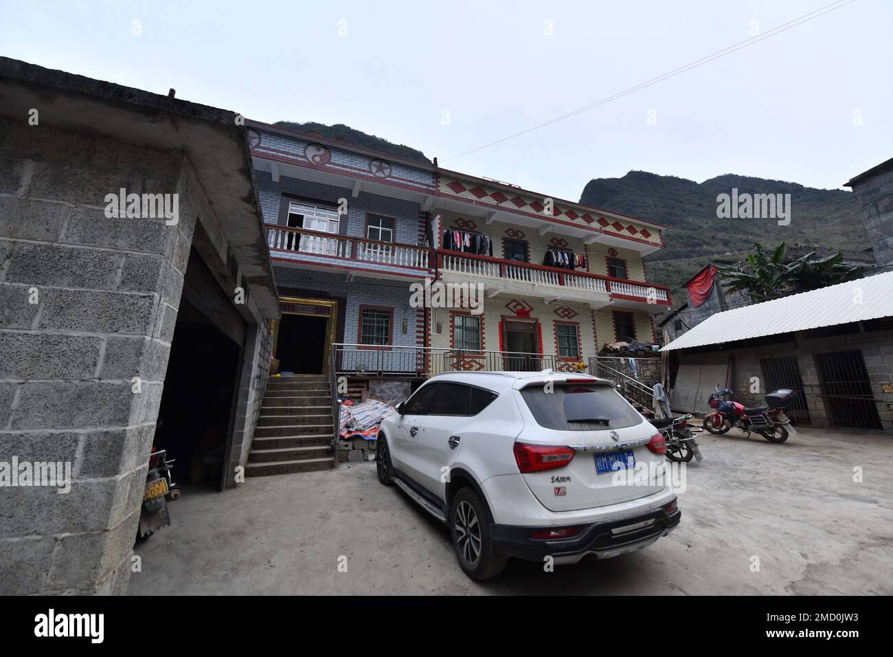 (230122) -- DAHUA, Jan. 22, 2023 (Xinhua) -- This photo taken on Jan. 20, 2023 shows the home of Meng Xuanren and Meng Xuantai in Nongding Village of Bansheng Town, Dahua Yao Autonomous County, south China's Guangxi Zhuang Autonomous Region.  Meng Xuanren and his younger brother Meng Xuantai were nicknamed 'ladder teenagers' because they had to climb mountains and hanging ladders to get to school as children.    They've all grown up and achieved their goals now. Meng Xuanren, 22, is a sophomore at the Liaoning Provincial College of Communications, and Xuantai, 19, works at an auto repair facto Stock Photo