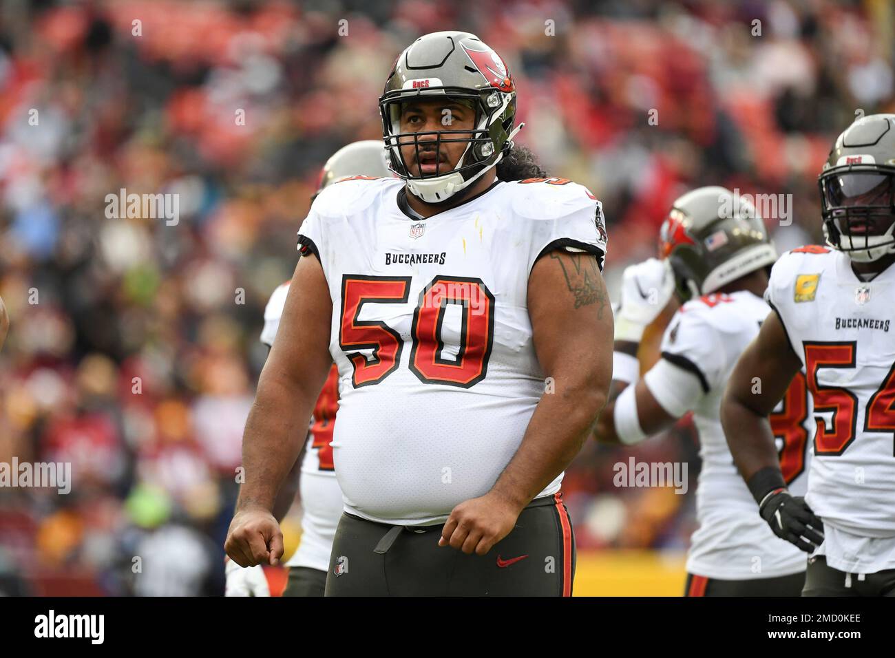 Tampa Bay Buccaneers defensive tackle Vita Vea (50) looks on between plays  during the second half of an NFL football game against the Washington  Football Team, Sunday, Nov. 14, 2021, in Landover,
