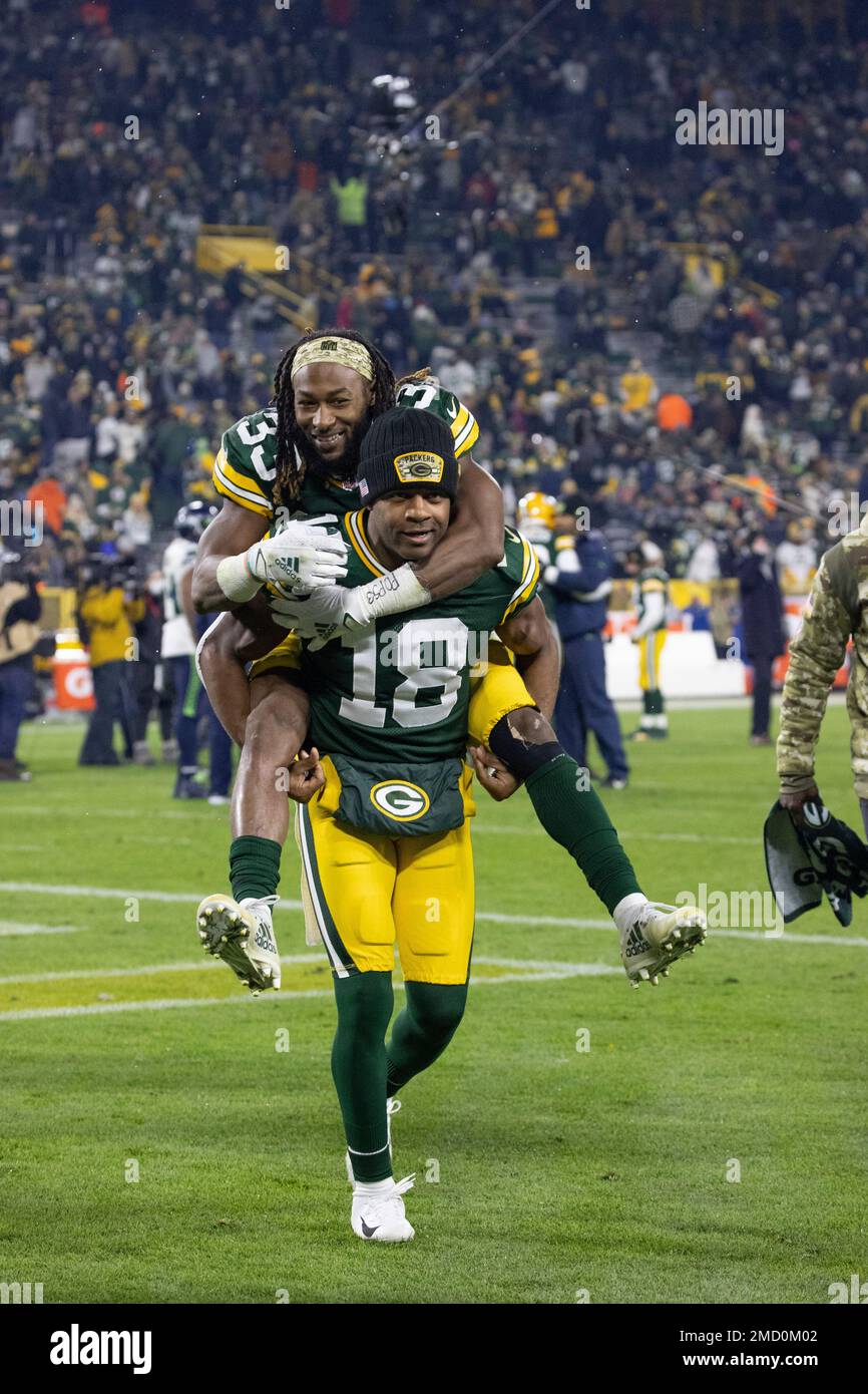 Green Bay Packers wide receiver Randall Cobb (18) carries off Seattle Seahawks safety Aaron