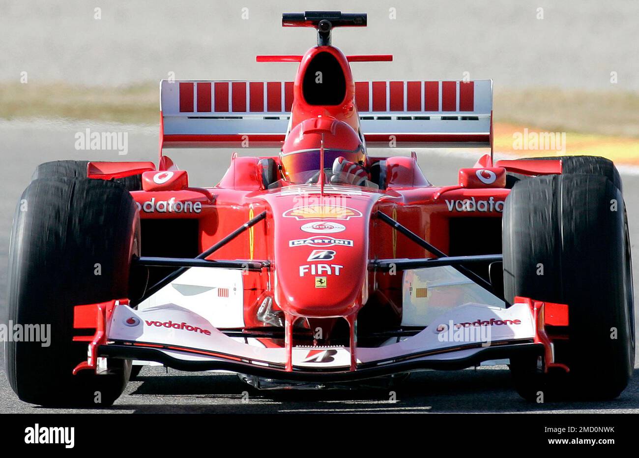 Italian Moto GP motorcycle World champion Valentino Rossi drives a Ferrari  Formula One car during a F1 motor racing test session at the Cheste's  racetrack near Valencia, Spain, on Feb.1, 2006. Rossi