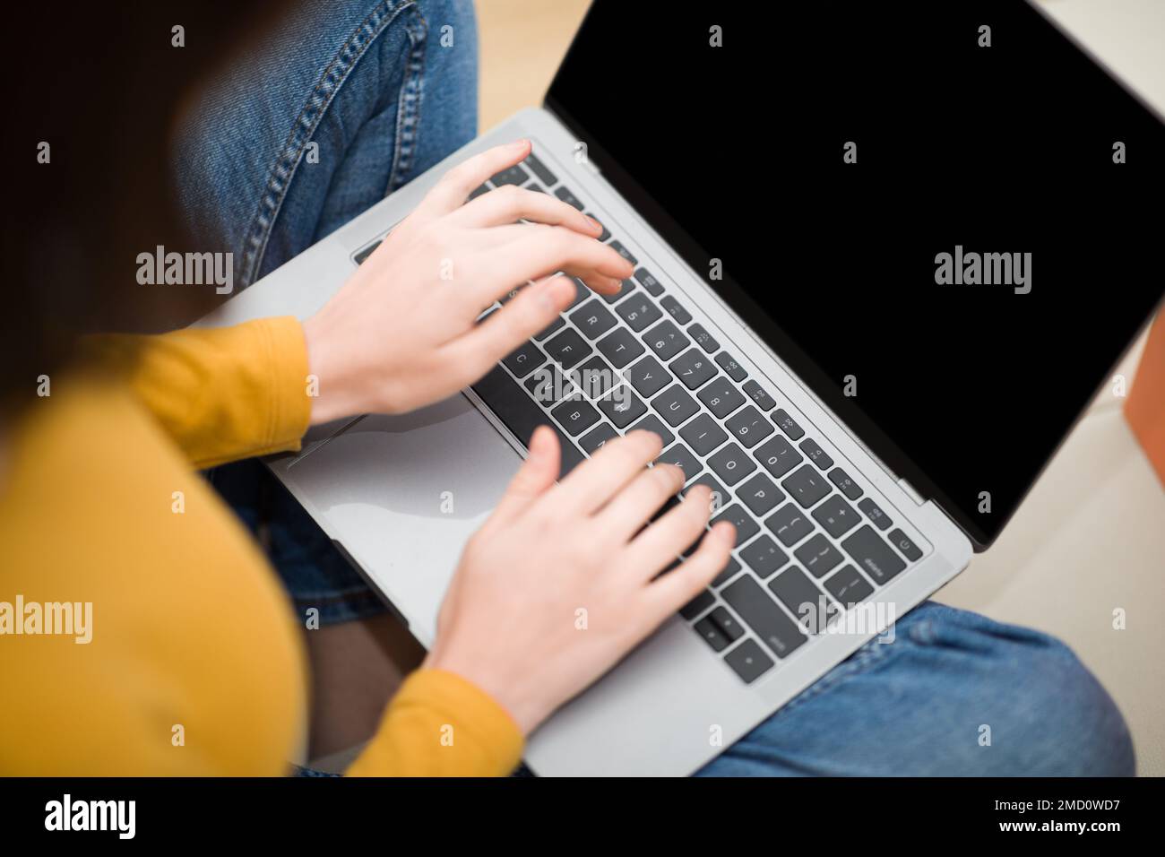 Online Remote Job. Cropped of woman typing on laptop Stock Photo