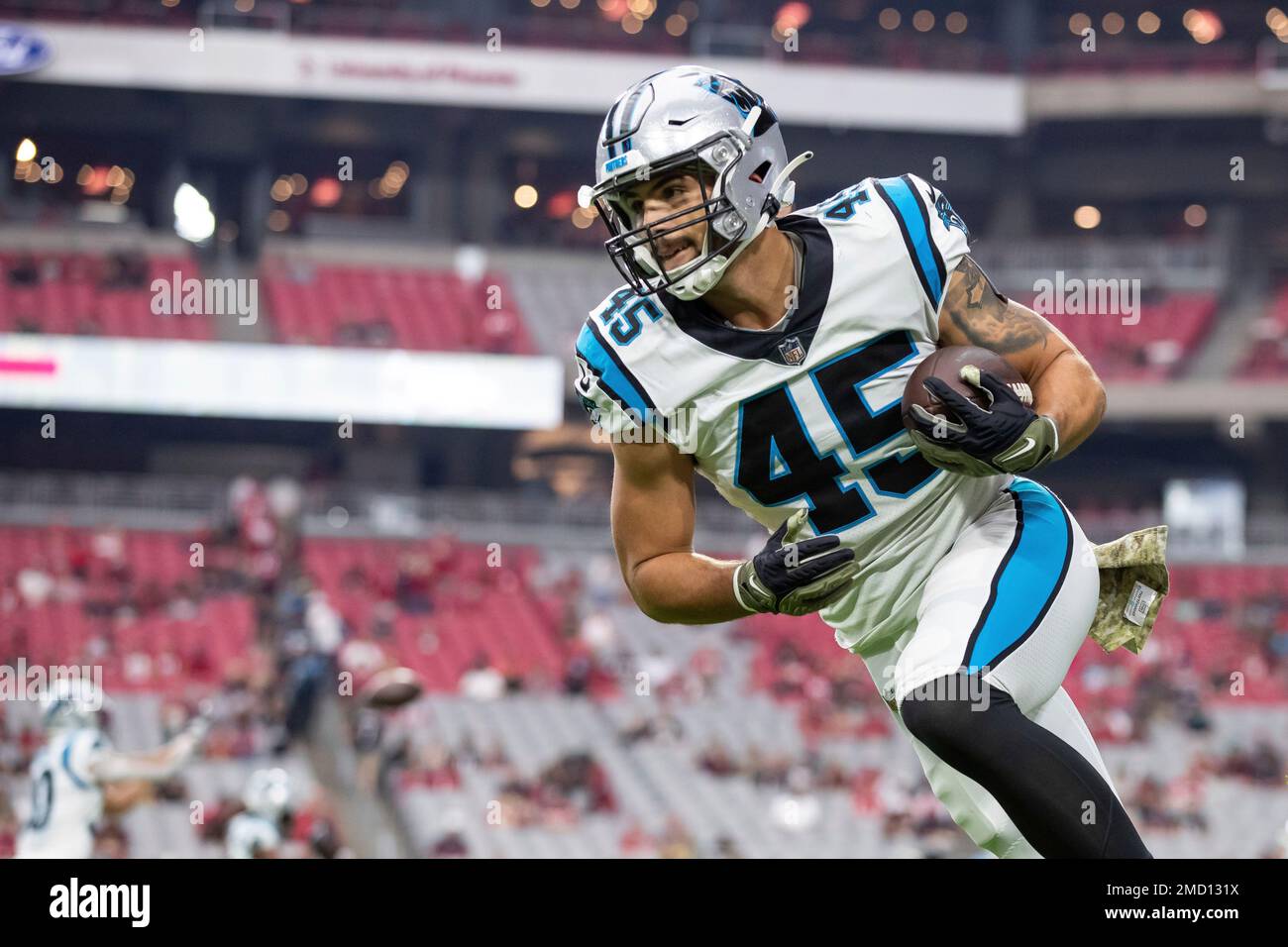 Fullback (45) Giovanni Ricci of the Carolina Panthers warms up before  playing against the Arizona Cardinals in an NFL football game, Sunday, Nov.  14, 2021, in Glendale, Ariz. (AP Photo/Jeff Lewis Stock