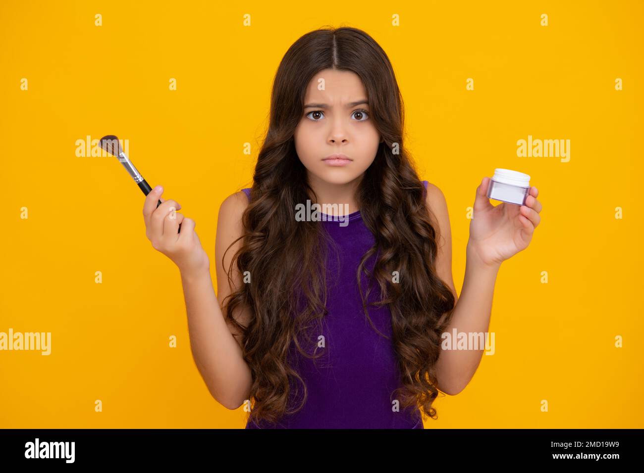 Kids make up products. Makeup teen child artist apply face powder with make  up brush. Beauty, and cosmetics for teenagers. Angry teenager girl, upset  Stock Photo - Alamy