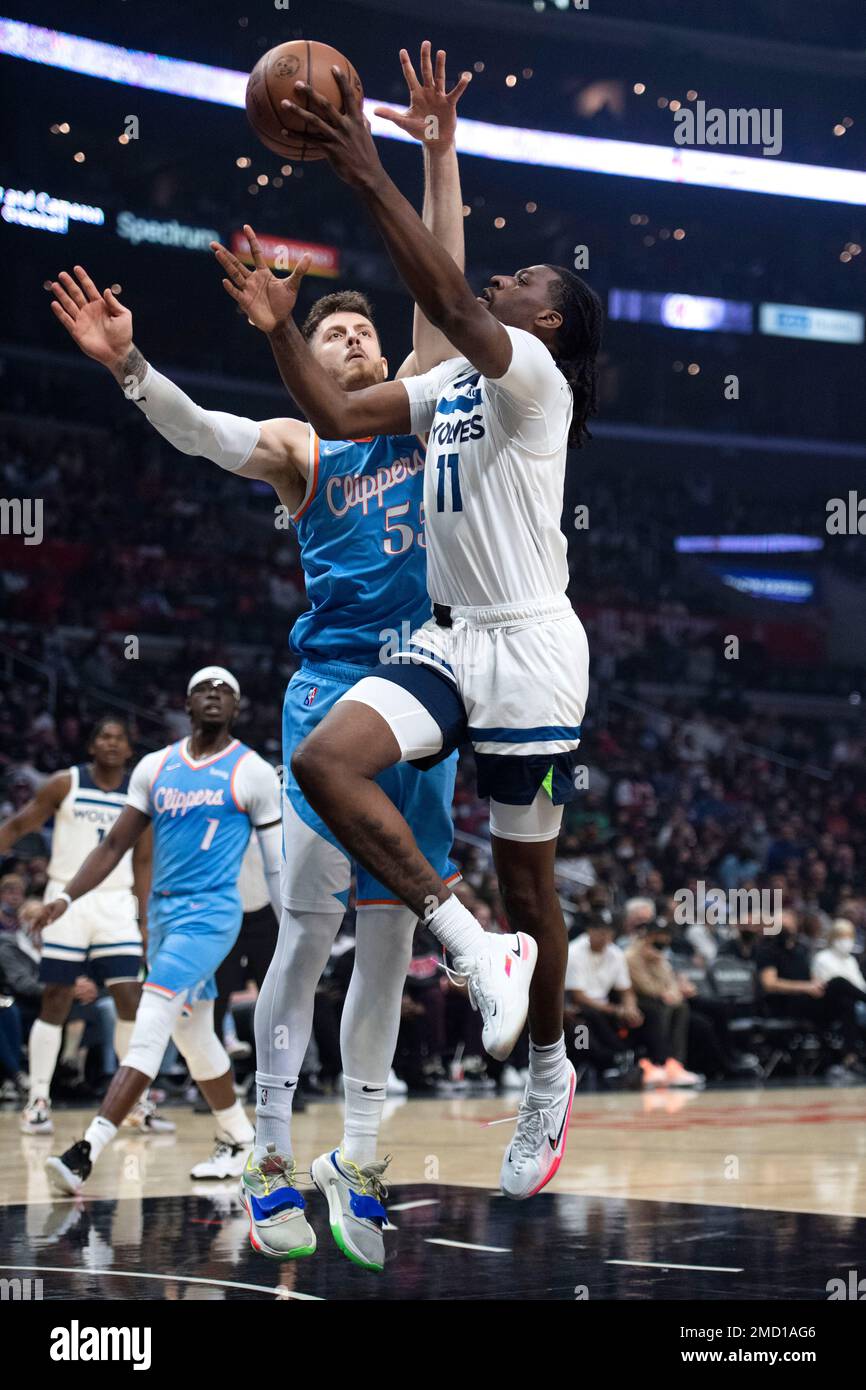 Minnesota Timberwolves center Naz Reid (11) goes up for a basket over Los  Angeles Clippers center Isaiah Hartenstein (55) during the first half of an  NBA basketball game in Los Angeles, Saturday,