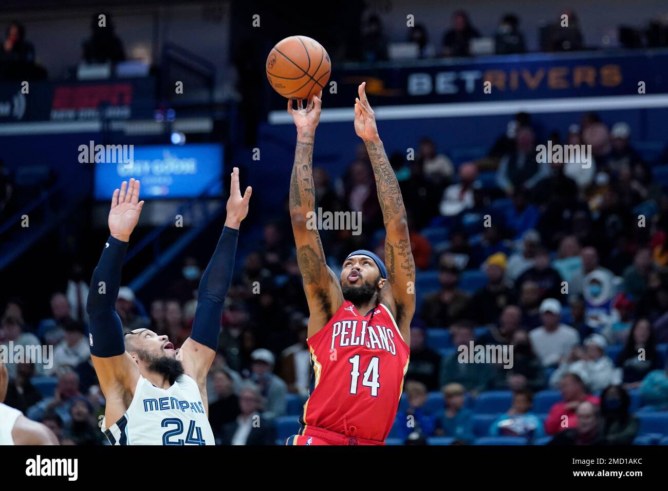 New Orleans Pelicans forward Brandon Ingram (14) shoots over Memphis Grizzlies forward Dillon Brooks (24) in the first half of an NBA basketball game in New Orleans, Saturday, Nov. 13, 2021. (AP Photo/Gerald Herbert) Stock Photo