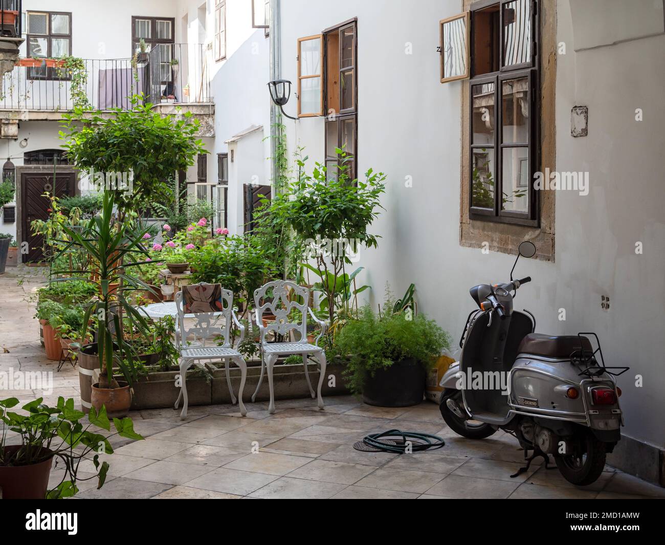 BUDAPEST, HUNGARY -  JULY 16, 2019:  Pretty courtyard scene in central Budapest Stock Photo