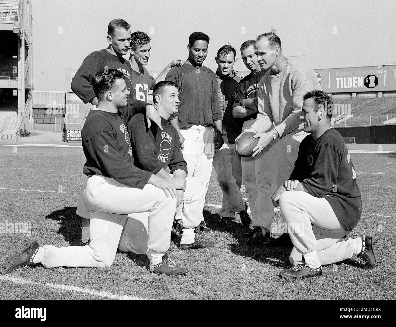 file-defensive-backfield-coach-tom-landry-holds-ball-as-new-york