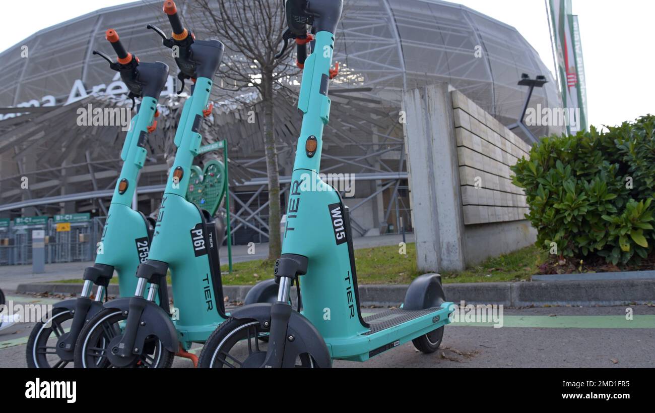 Tier dockless hire electric scooters outside the Groupama Aréna or