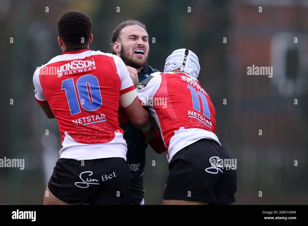 Ystrad Mynach, UK. 22nd Jan, 2023. Max Clark of Dragons (c) is stopped by Jordan Hendrikse (10) & Edwill van der Merwe (11) of Emirates Lions. European challenge cup rugby, pool B match, Dragons v Emirates Lions at the CCBC Centre for Sporting Excellence in Ystrad Mynach, Wales on Sunday 22nd January 2023. pic by Andrew Orchard/Andrew Orchard sports photography/Alamy Live news Credit: Andrew Orchard sports photography/Alamy Live News Stock Photo