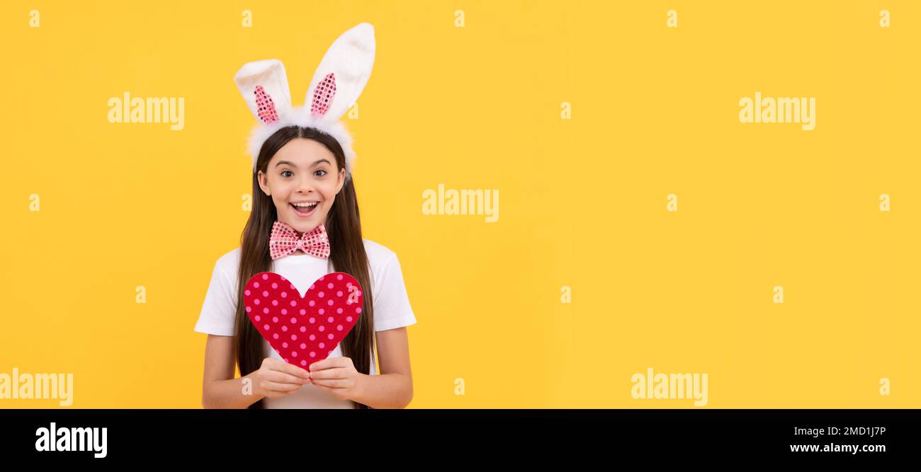 cheerful bunny kid with love heart. happy easter holiday. Easter child ...