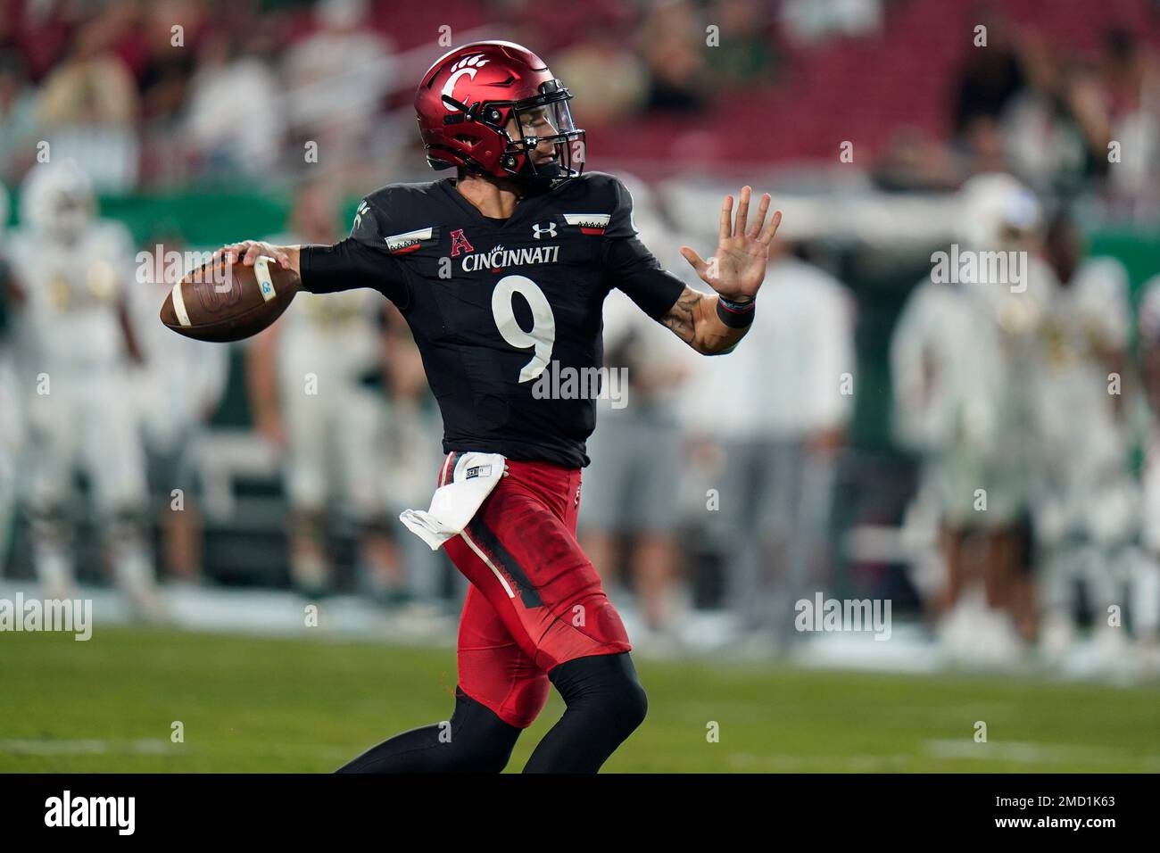 Cincinnati quarterback Desmond Ridder throws a pass against South ...
