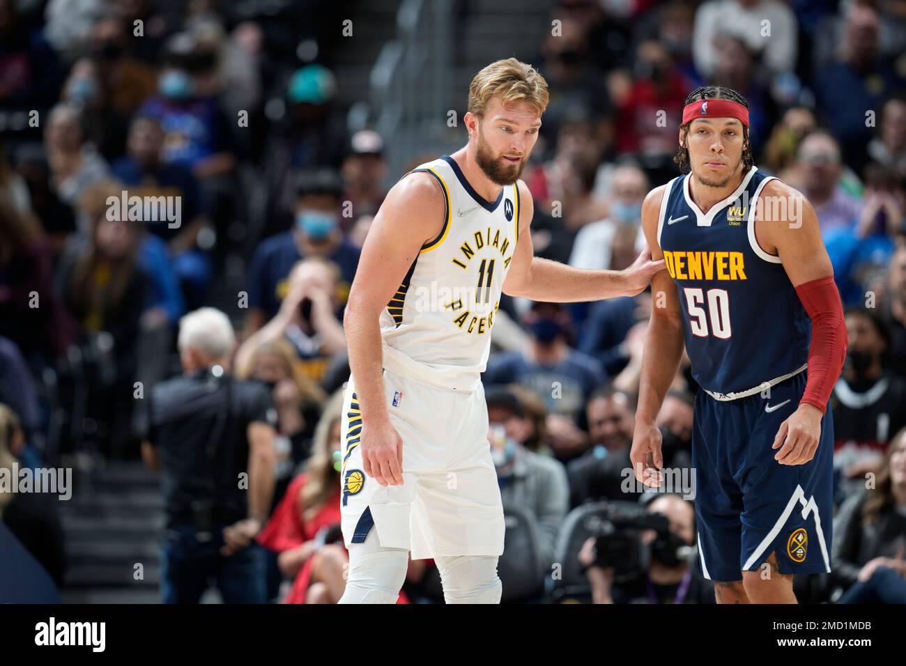 Indiana Pacers forward Domantas Sabonis (11) and Denver Nuggets forward Aaron Gordon (50) in the second half of an NBA basketball game Wednesday, Nov. 10, 2021, in Denver. The Nuggets won 100-96. (AP Photo/David Zalubowski) Stock Photo