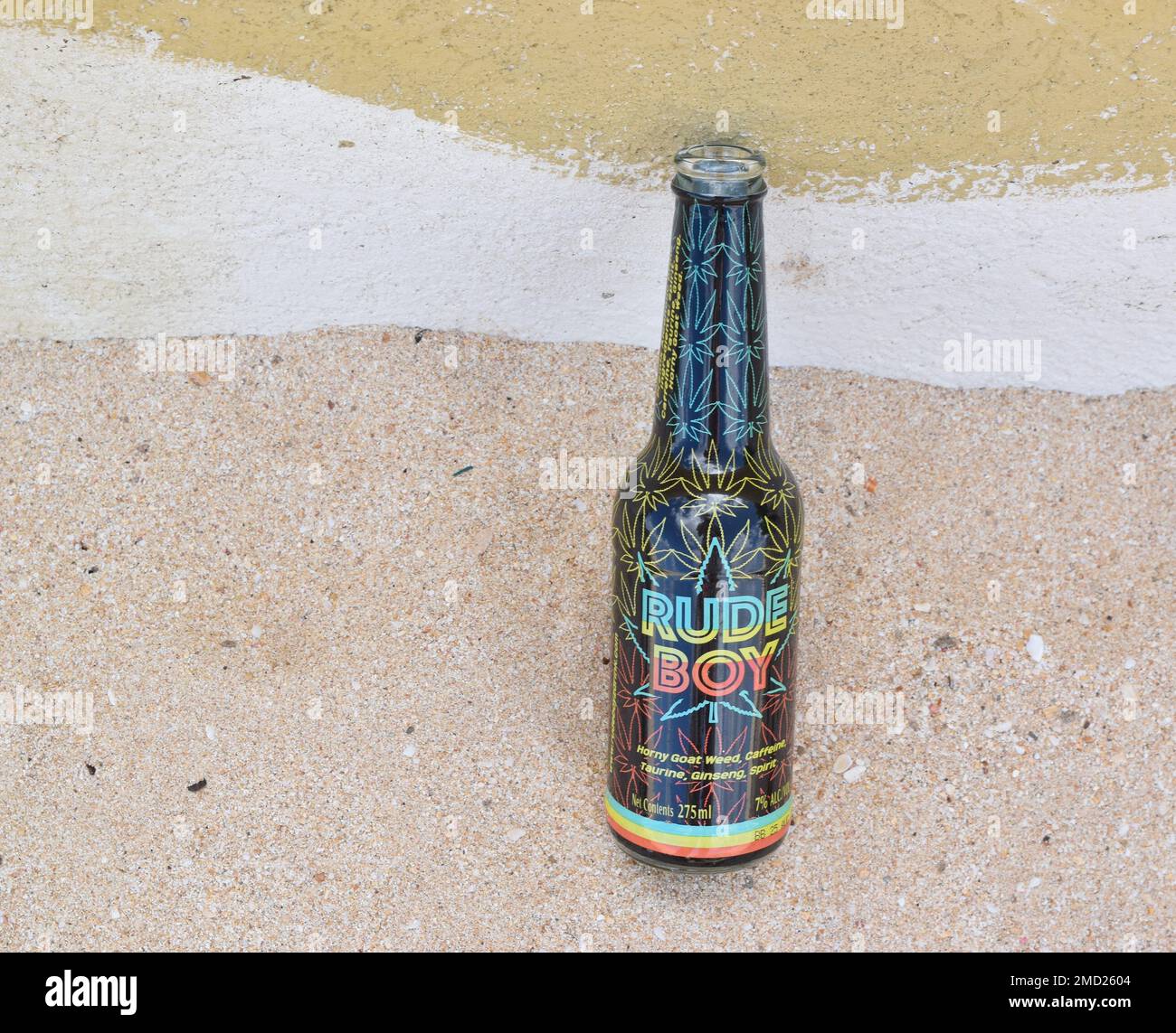 Rude boy beer bottle on sandy beach Stock Photo Alamy