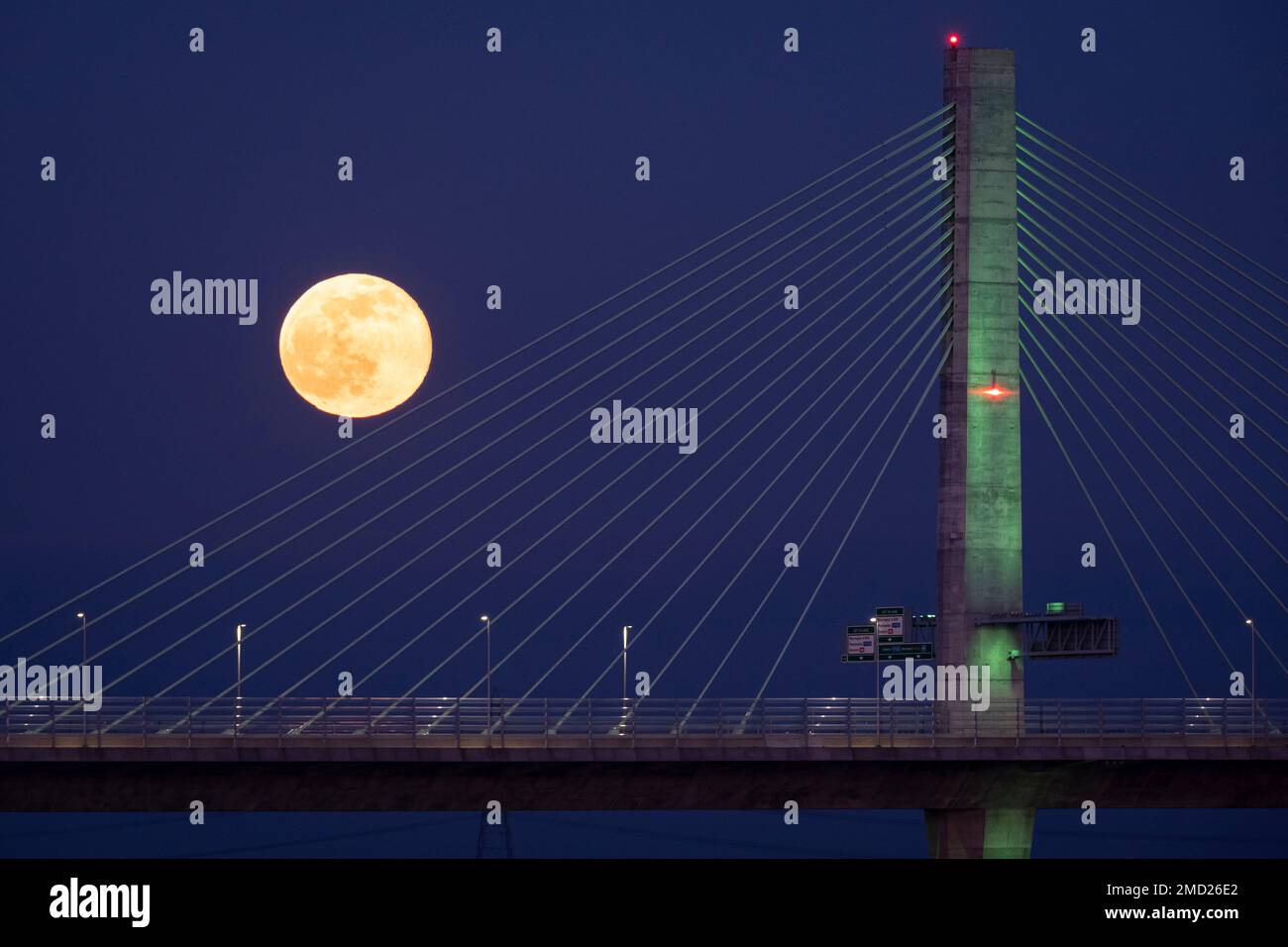 Full Moon over the Mersey Gateway Bridge at night, River Mersey, Runcorn, Cheshire, England, UK Stock Photo