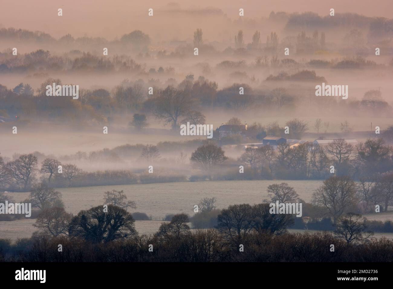 Mist and Fog covers the Cheshire Plain, viewed from Pot Bank, near Mow Cop, Cheshire, England, UK Stock Photo