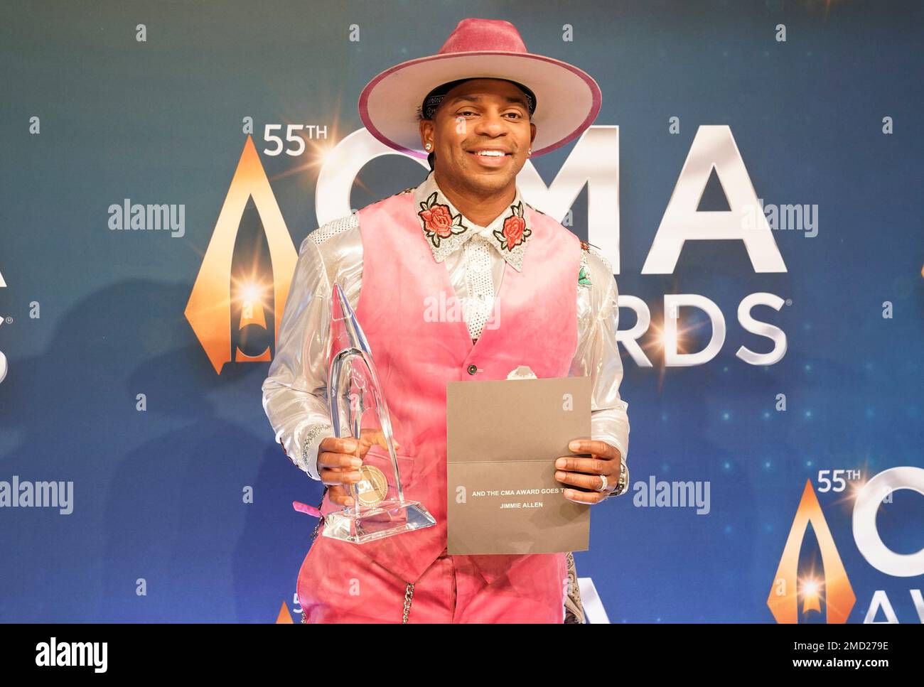 Jimmie Allen poses in the press room with the new artist of the year