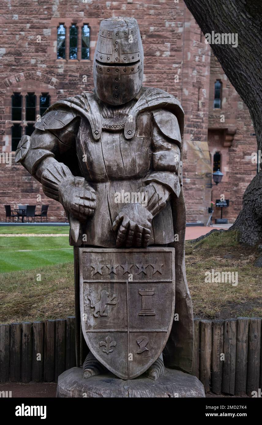 Chainsaw carving of a nine foot tall Knight, Peckforton Castle, Peckforton, Cheshire, England, UK. Stock Photo