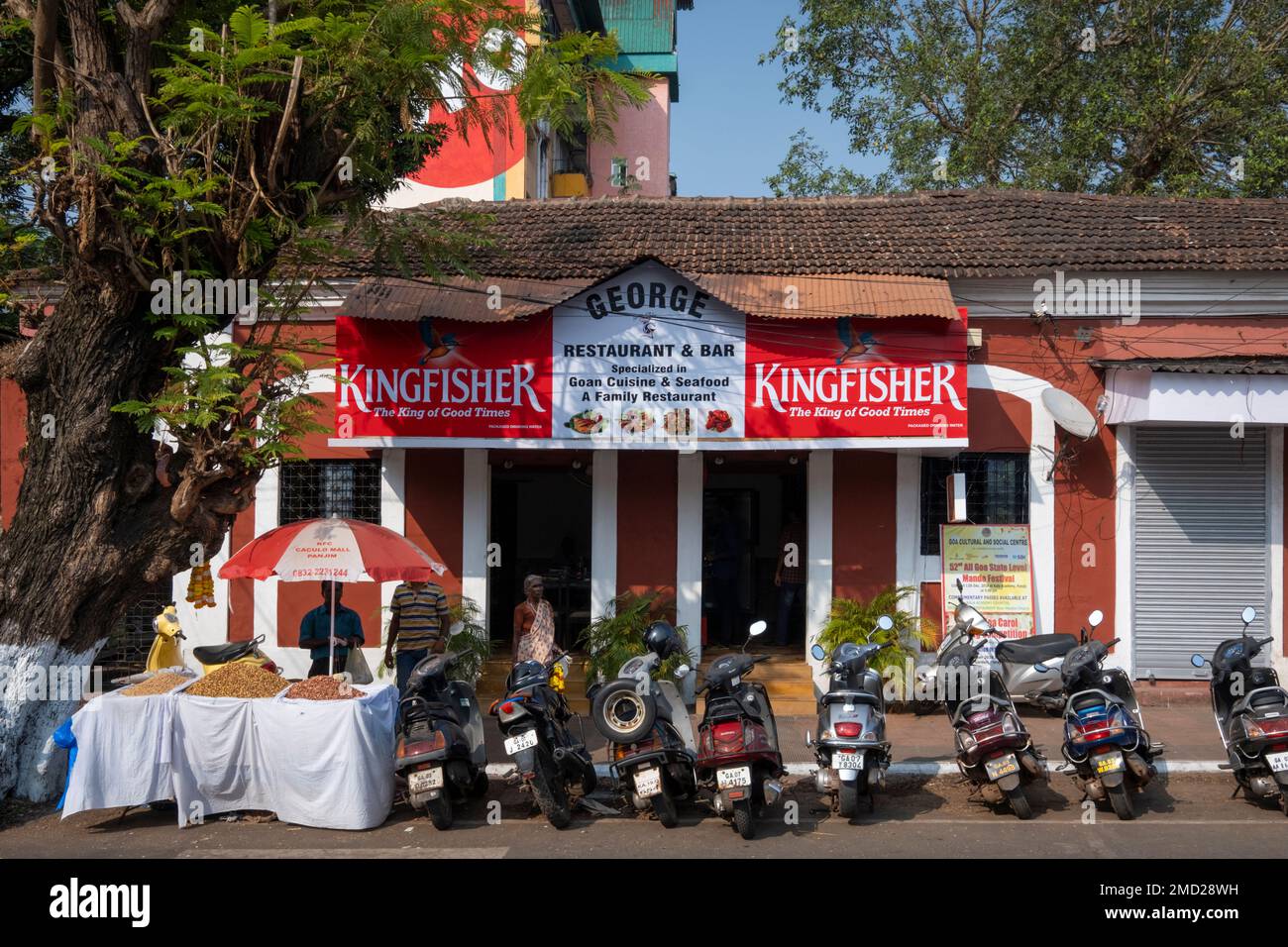 Motorcycles lined up outside a Local Restaurant, Panjim City, Goa, India, Asia Stock Photo