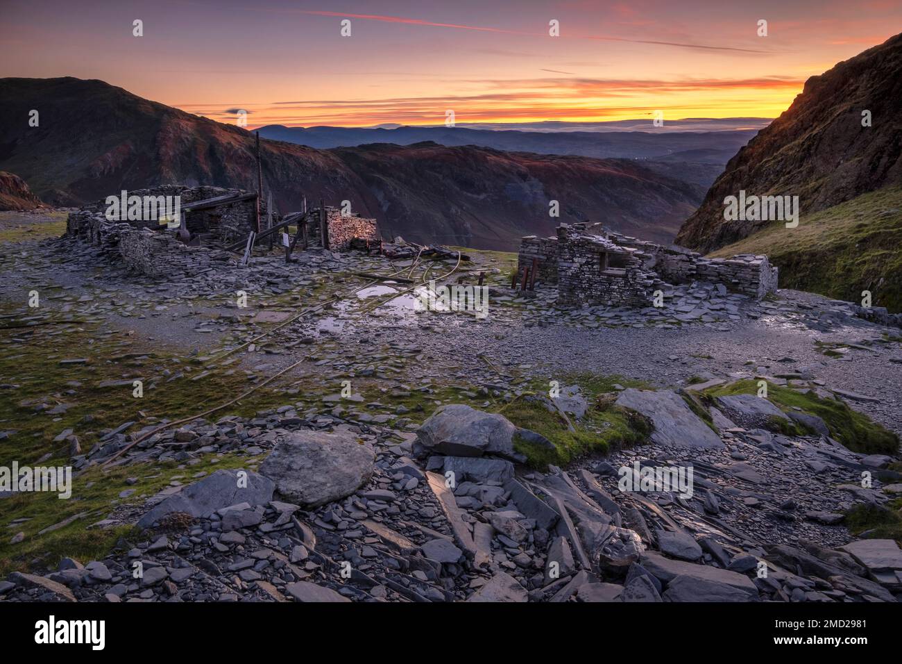 Saddlestone Quarry backed by Wetherlam and the Coniston Fells at dawn, Old Man of Coniston, near Coniston, Lake District National Park, England, UK Stock Photo