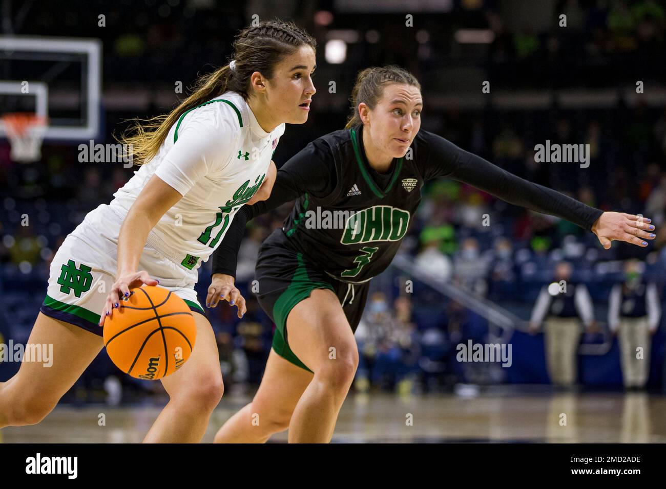Notre Dame's Sonia Citron (11) drives in next to Ohio's Madi Mace (3) during an NCAA basketball