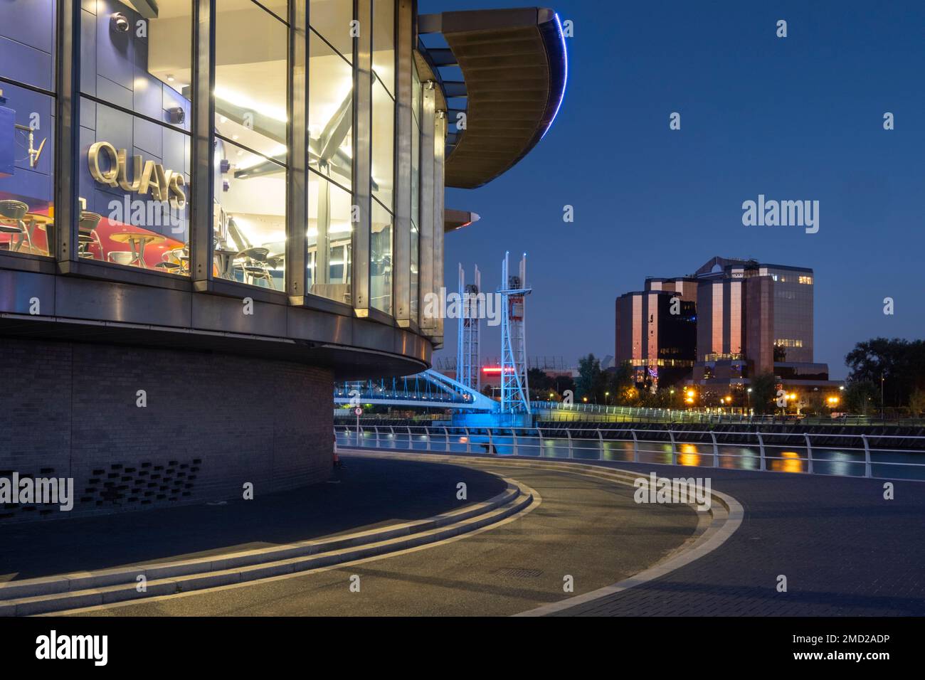 The Lowry Centre Theatre and Quay West Building at night, Salford Quays, Salford, Manchester, England, UK Stock Photo