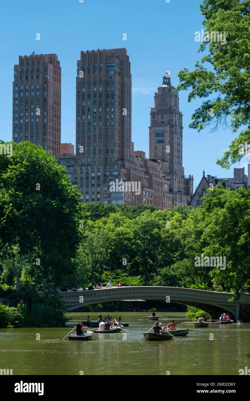 The Majestic Apartments Building on Central Park West, above Central Park Lake and Bow Bridge, New York City, New York, USA Stock Photo