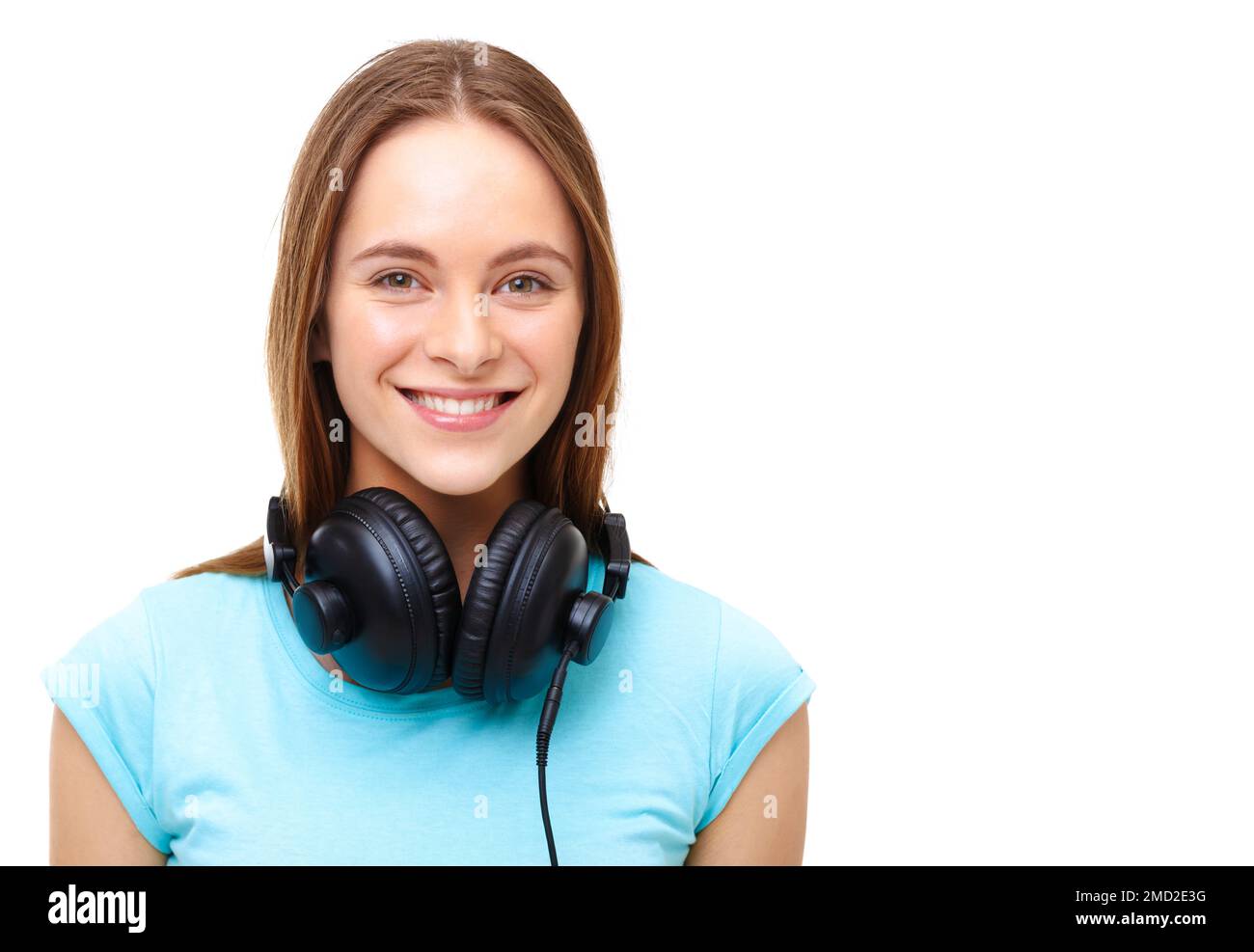 Portrait of young woman with headphones around her neck isolated on
