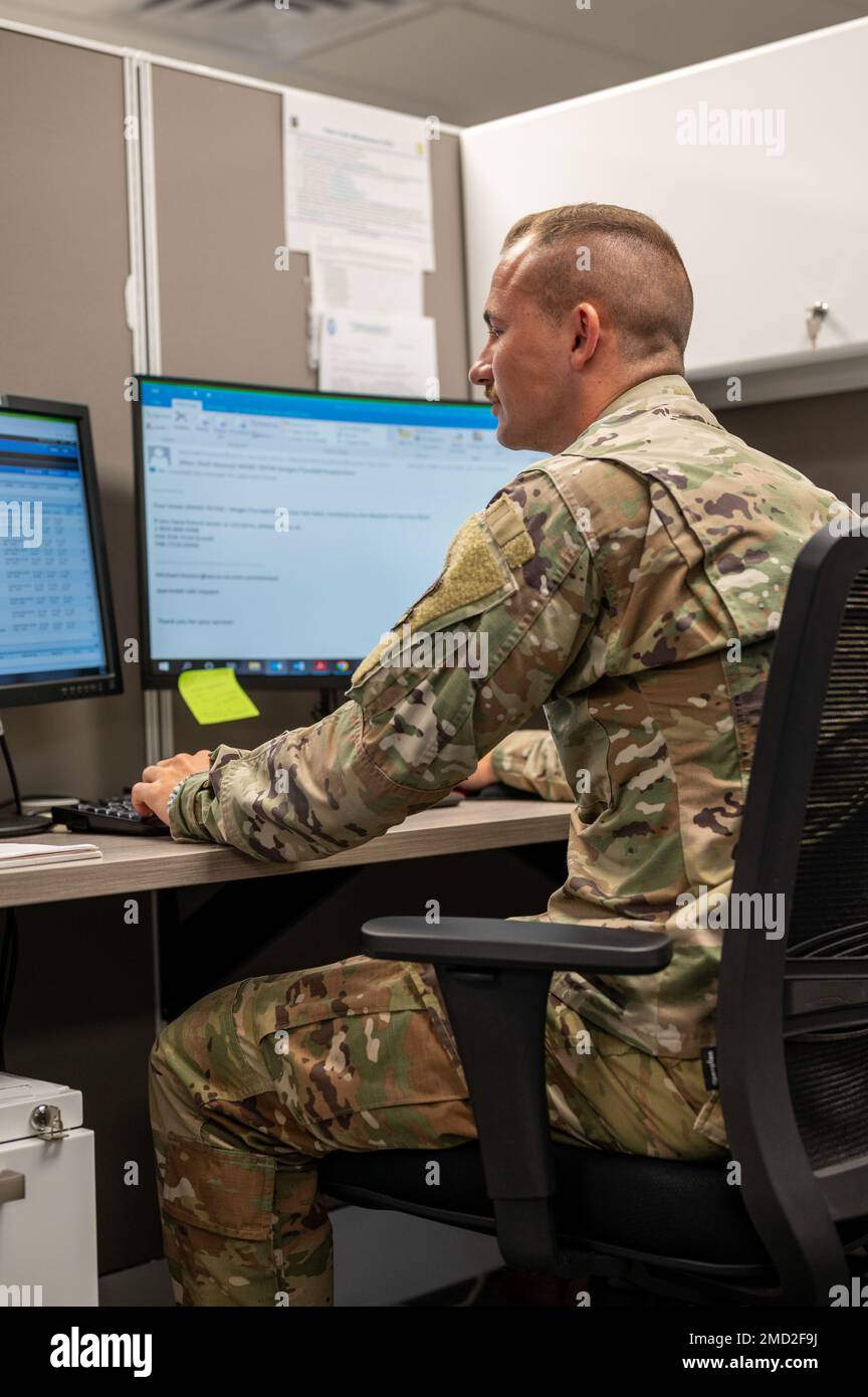 U.S. Air Force Senior Airman Zane Geiger, 325th Civil Engineer Squadron customer service operator, reviews a list of service requests at Tyndall Air Force Base, Florida, July 12, 2022. Each service request needs to be prioritized based on importance and while all issues are fixed, some need immediate assistance. Stock Photo