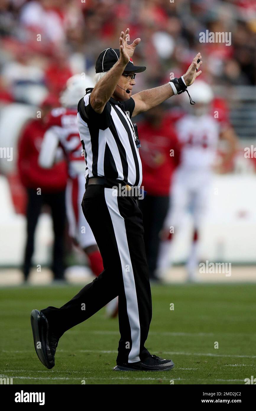 Field judge Rick Patterson (15) signals during an NFL football game between the San Francisco