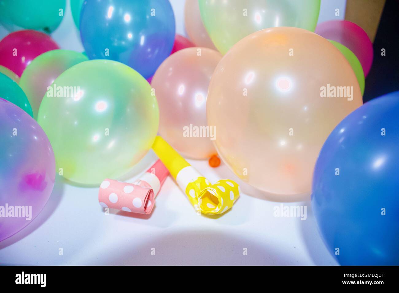 The colorful balloons and party horns for birthday celebration Stock ...