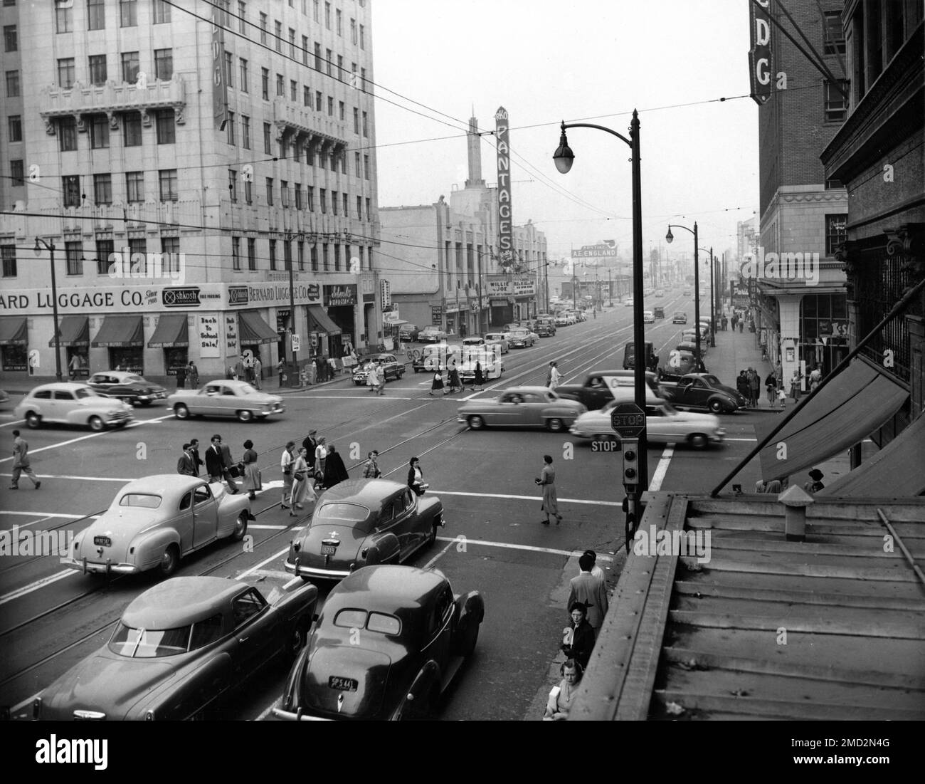 Intersection of HOLLYWOOD BOULEVARD and VINE STREET in 1952 with RKO PANTAGES movie theatre and SCHWAB'S PHARMACY visible Stock Photo