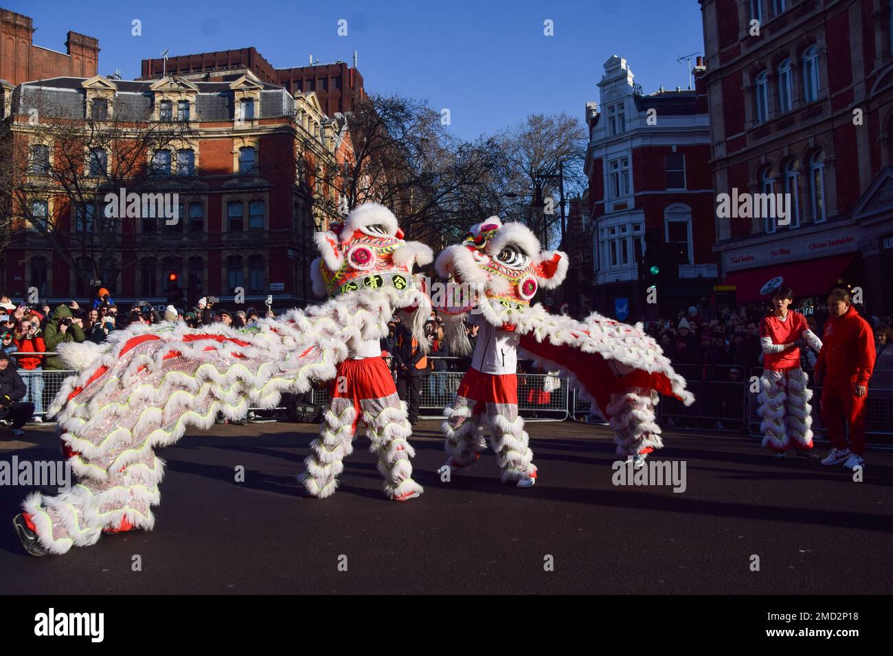 London, UK. 22nd Jan, 2023. Traditional lion dancers entertain the ...
