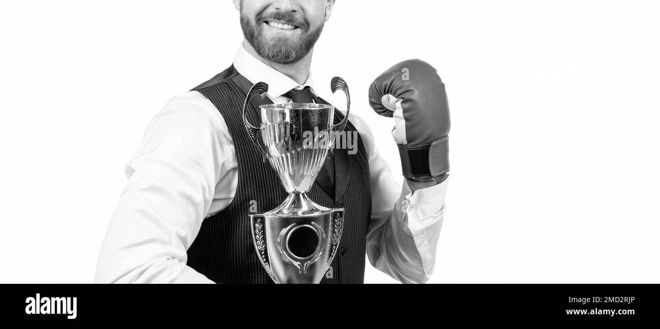 successful businessman in boxing gloves hold champion cup isolated on