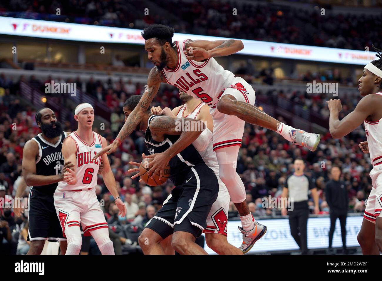 Chicago Bulls' Derrick Jones Jr. (5) gets airborne on a head fake by Brooklyn Nets' LaMarcus