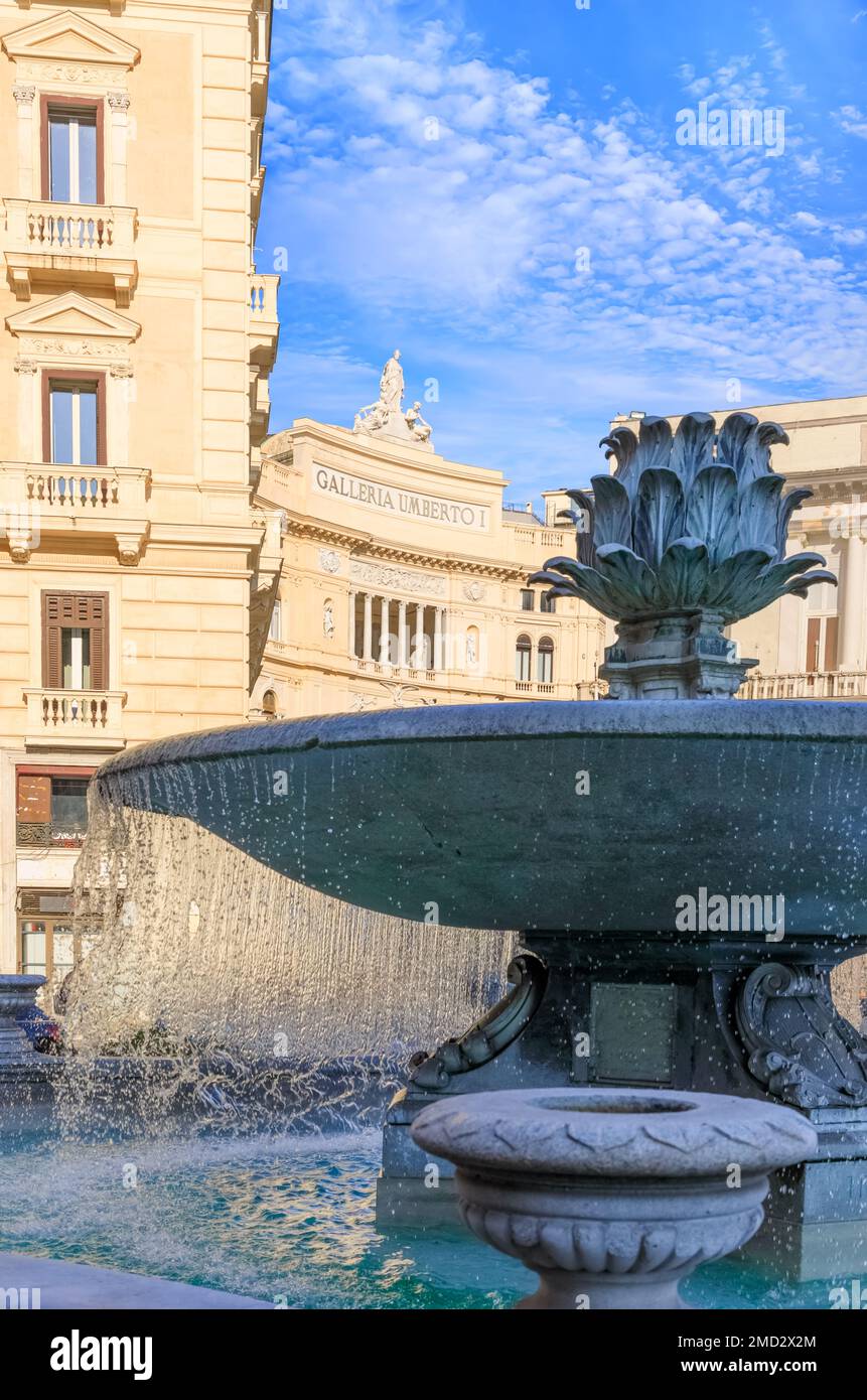 Urban view of Naples: Fountain of the Artichoke into Square Trieste and Trento. The inscription 'Galleria Umberto I' means 'Umberto I Gallery'. Stock Photo