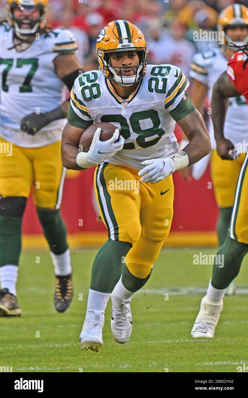 Green Bay Packers running back A.J. Dillon (28) rushes up field with