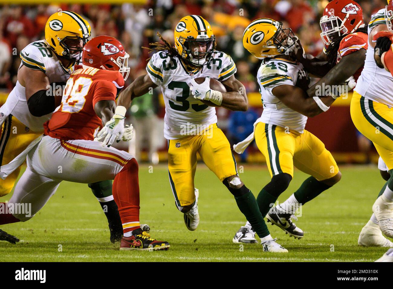 Green Bay Packers running back Aaron Jones (33) carries against the