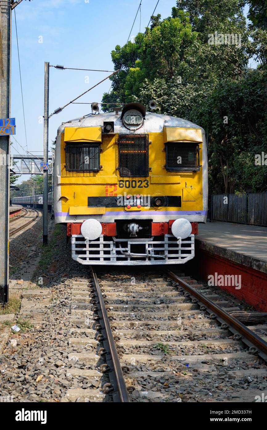 Picture of electric Local Train standing at a Railway Station of Indian Railways system. Kolkata, West Bengal, India Stock Photo