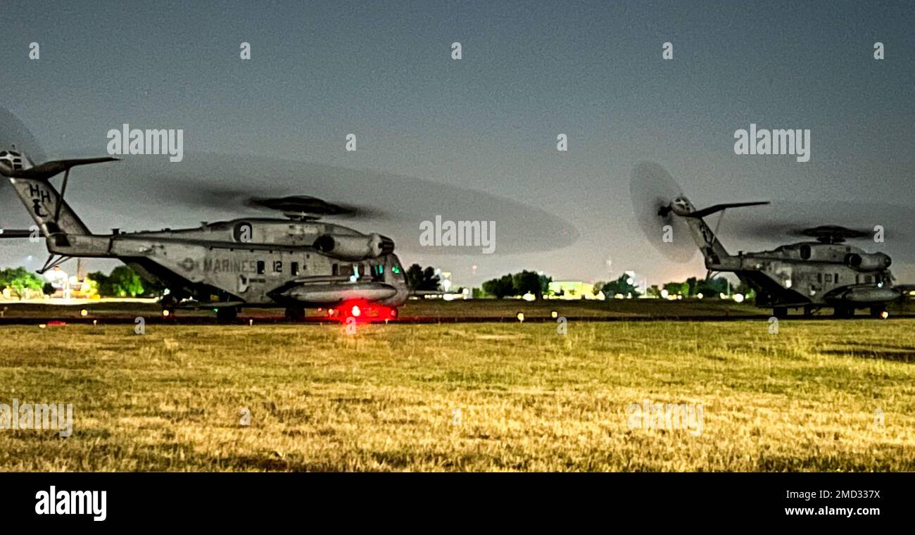 Two Marine CH53 Sea Stallion helicopters taxi along the Henry
