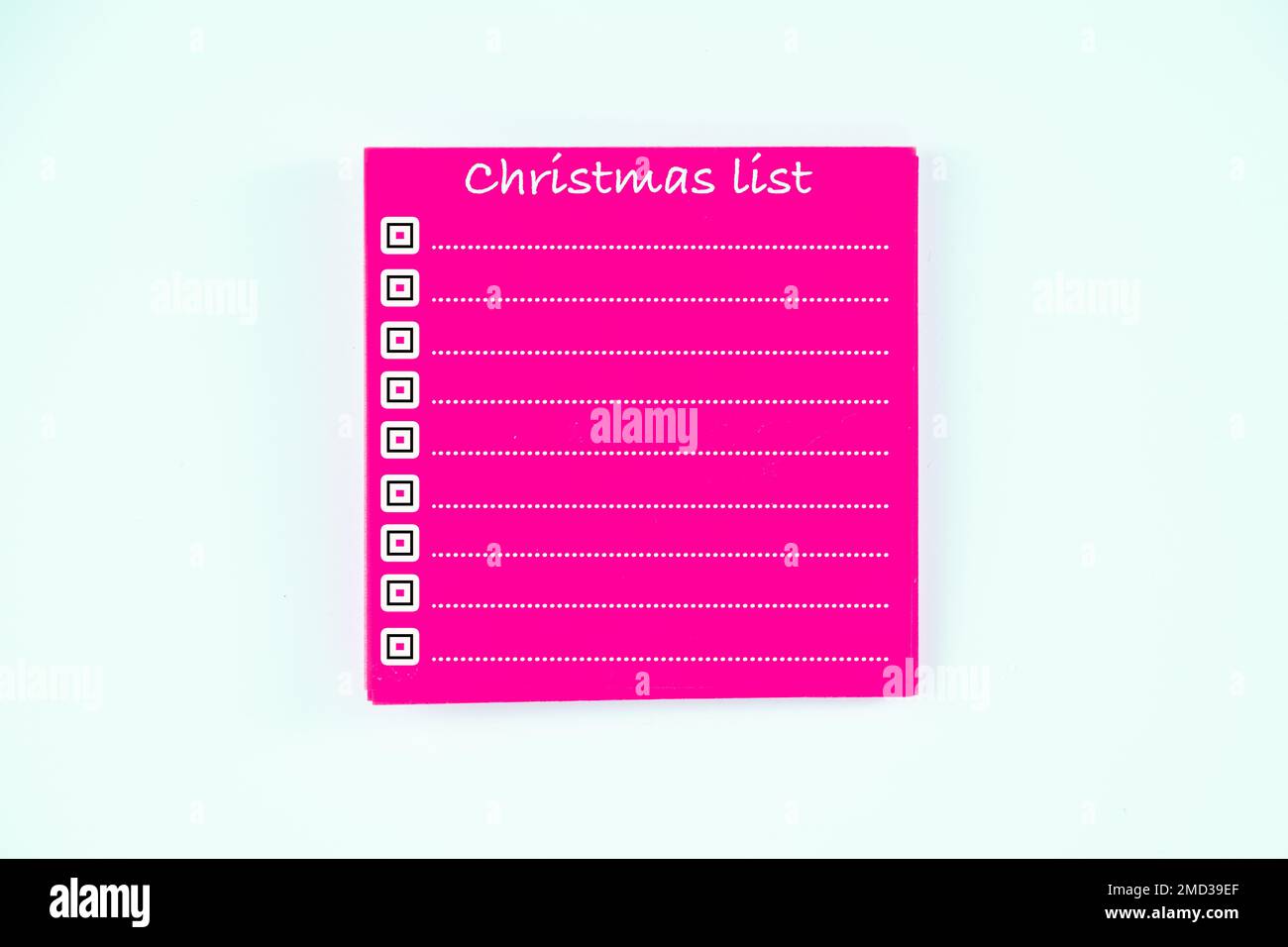 adhesive sticky pad template for notes christmas list mock up office party home list in pink isolated on a white background Stock Photo