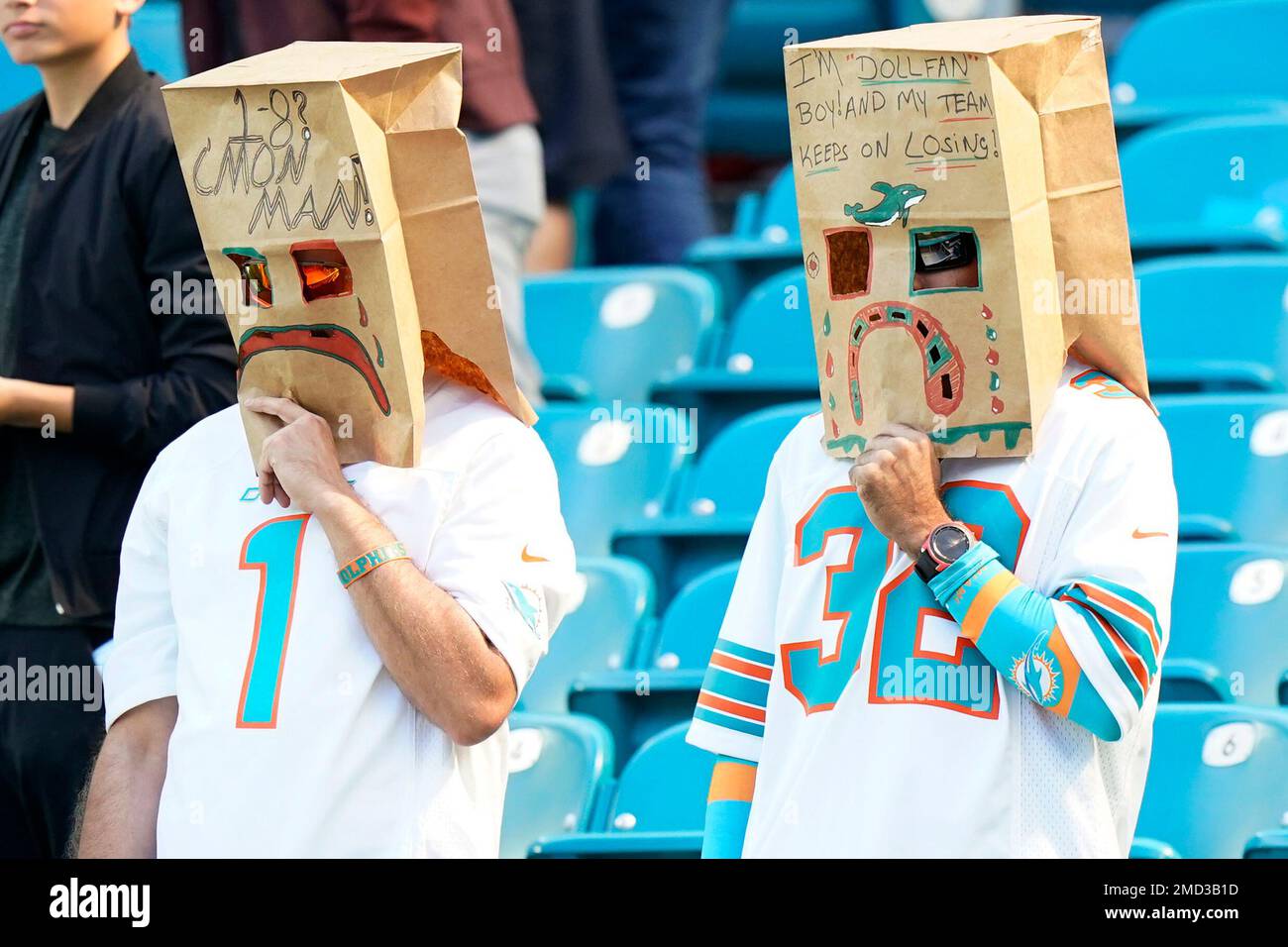 Miami Dolphins fans wear paper bags on their heads before an NFL football  game against the Houston Texans, Sunday, Nov. 7, 2021, in Miami Gardens,  Fla. (AP Photo/Wilfredo Lee Stock Photo - Alamy